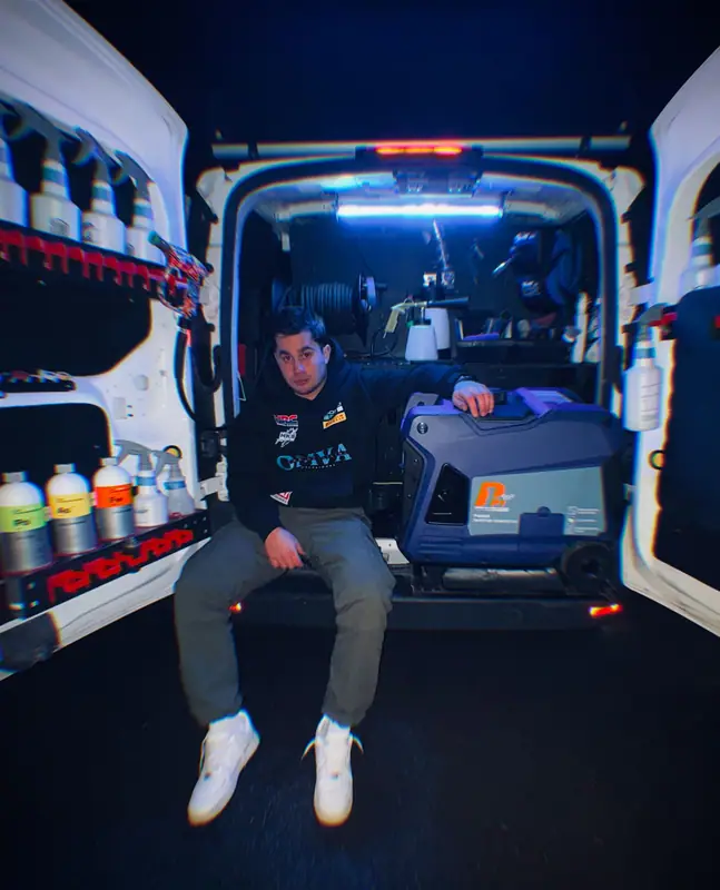 Fisheye shot of Omar in the back of the OMVA van
